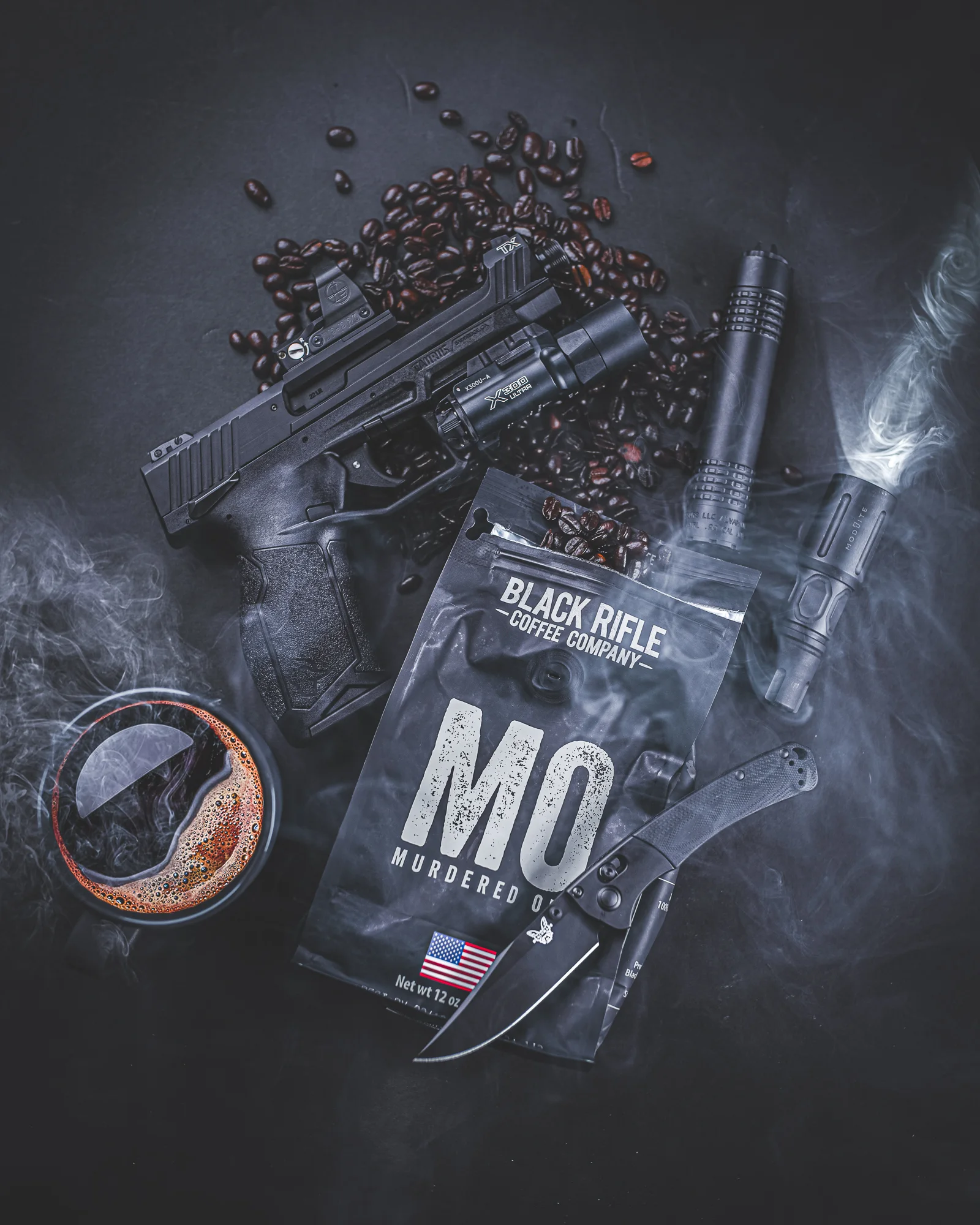 Suppressed pistol, RS can, and black coffee on a dark bench